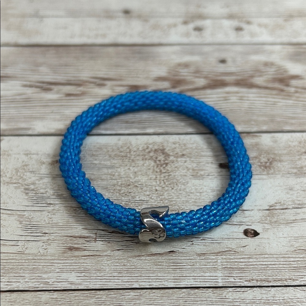Sashka Roll On Blue Nepal Glass Braided Bracelet with Silver Wave Clasp